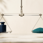 A large navy mass balances many fine teal granules and a small amber fractional ring